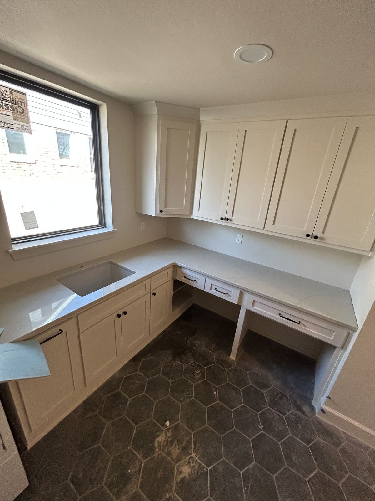 White kitchen with dark countertops